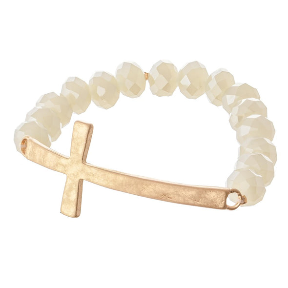 Natural faceted beaded stretch bracelet featuring an east west cross focal